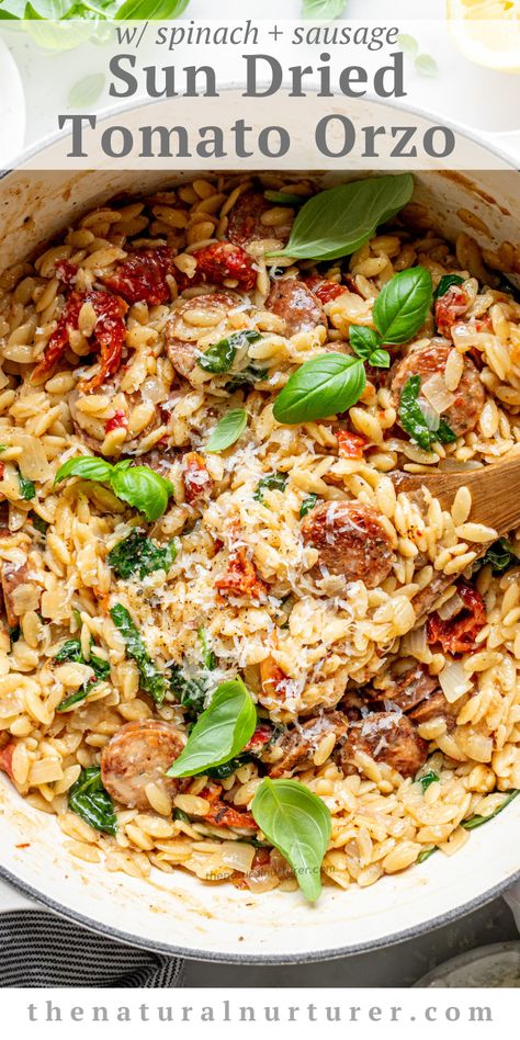 This sun dried tomato orzo has browned chicken sausage coins, baby spinach,   parmesan cheese stirred in & a flavor that will knock your socks off. Orzo With Italian Sausage, Spinach Sun Dried Tomato Orzo, Creamy Sun Dried Tomato Chicken Orzo, Creamy Sundried Tomato Chicken Orzo, Sun Dried Tomato Dinner Recipes, Orzo Sausage Spinach Recipes, Creamy Chicken Sausage Orzo Skillet, Sausage And Orzo Skillet, Orzo With Chicken Sausage