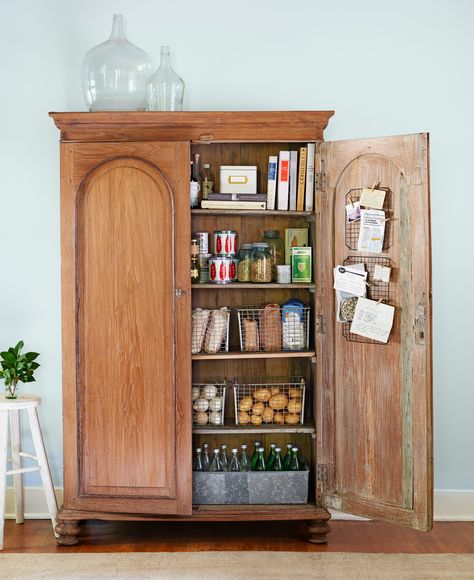 Turn an Armoire into a Pantry: No need for built-ins. Stand-alone storage, like this armoire-turned-cupboard, is one of the latest kitchen trends. Shop Storage, Organisation, Upcycle Storage, Dream Pantry, Kitchen Baskets, Pantry Shelving, Kitchen Organization Pantry, Kitchen Jars, Kitchen Containers