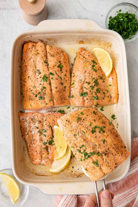 This recipe for lemon pepper salmon is both quick and easy to prepare. It's a protein-rich dinner option with a sharp, citrusy flavor punch. | Lemon Pepper Salmon | Baked Lemon Pepper Salmon | Baked Salmon with Lemon | Lemon Pepper Salmon Recipe | Lemon Pepper Salmon in Oven | Lemon Pepper Fish | Feelgoodfoodie Recipes, Salmon In Oven, Lemon Pepper Fish, Healthy Fish Dinners, Baked Salmon With Lemon, Baked Salmon Lemon, Oven Salmon, Lemon Pepper Salmon, Salmon Baked