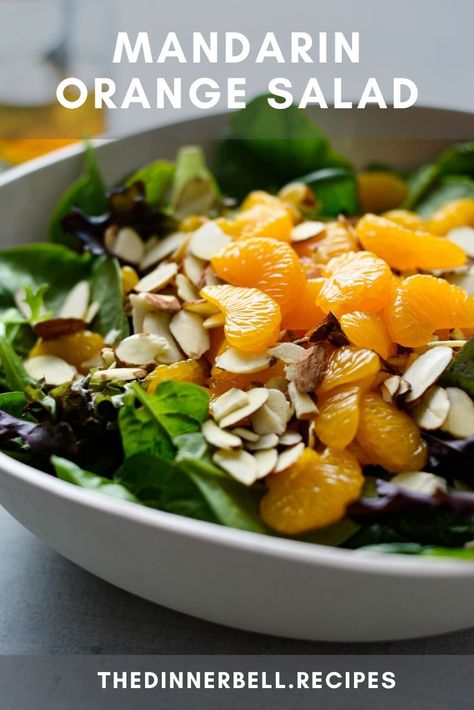 No slicing, dicing or chopping required! This Mandarin Orange Salad is the summer side dish that goes with everything. Sweet oranges, crunchy almonds and a zingy bite from a quick homemade vinaigrette that comes together in minutes. Orange Onion Salad, Salad With Tangerines, Asian Salad Mandarin Oranges, Mandarins Orange Salad, Mandarin Orange Salad Recipes, Salad With Orange Slices, Asian Salad With Mandarin Oranges, Salads With Mandarin Oranges, Manderine Orange Salad