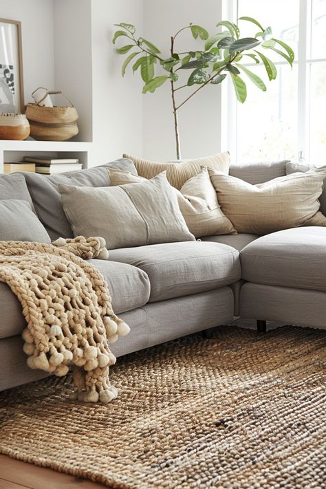 19 grey couch living room ideas Rug For Light Grey Couch, Styling A Light Grey Couch, Grey Sofa Cream Cushions, Neutral Living Room With Gray Couch, Grey Sectional Couch Living Room Ideas, Warm Aesthetic Living Room, Grey Lounge Styling, Gray Couch Living Room Ideas Modern, Light Gray Sofa Living Room Ideas