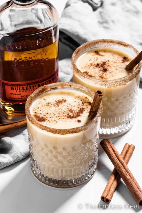 If you longed to dip into the holiday punch bowl that held the spiked eggnog, now's your chance to indulge in this sweet, warm, delicious bourbon eggnog. It's creamy and cozy and perfect for a cold winter's evening. #theendlessmeal #bourboneggnog #boozyeggnog #bourbon #eggnog #christmas #holiday #festive #cocktail #drink Christmas Cocktails Eggnog, Cozy Christmas Cocktails, Eggnog Bourbon Cocktail, Christmas Eggnog Cocktails, Christmas Cafe Drinks, Holiday Eggnog Cocktails, Yule Cocktails, Christmas Breakfast Cocktails, Egg Nog Cocktail Recipe