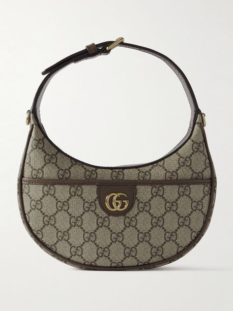 Gucci's accessories are nothing short of impeccable. This 'Ophidia' shoulder bag has been crafted in Italy from coated-canvas in a crescent shape, trimmed with a leather strap and centered with the iconic 'GG' hardware. Store your lip balm and compact as well as cardholder in the pocket. Gucci Saddle Bag, Gucci Hand Bags, Mini Shoulder Bag Outfit, Gucci Bag Ophidia, Brown Gucci Bag, Gucci Ophidia Bag, Y2k Bags, Shoulder Bag Outfit, Gucci Clothing