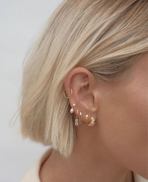 Our Biarritz Mini Hoops are the season's most coveted earring, featuring staggered baguette quartz stones creating a subtle element of sparkle that is sure to elevate any look. Crafted from high quality 925 sterling silver with 18k gold plating (gold vermeil) Set with AAA quality clear CZ stones Outer diameter 14mm Nickel free & hypoallergenic Will arrive beautifully packaged in our branded pouch Three Hoop Ear Piercings, Simple Earring Stack Ideas, Earrings Stacking Ideas, Bridal Earring Stack, Piercing Stack Ideas, Gold And Silver Earrings Mixing, Multiple Ear Piercings Minimalist, Earring Inspo Ears, Earring Stacks Silver