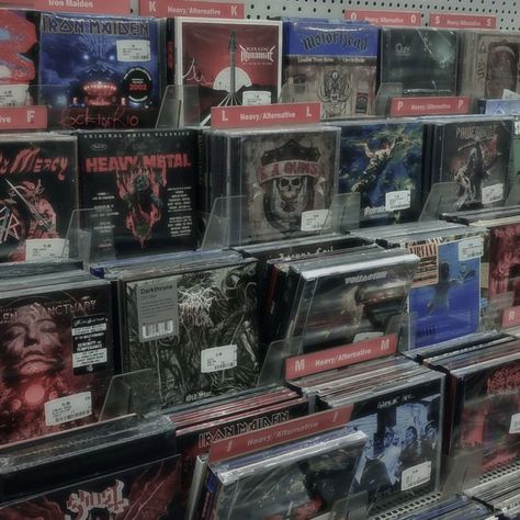 a shelf with lots of rock, death metal, alternative music CDs Playlist Covers Metal, Metal Athestic, Metal Aethstetic, Rock Albums Aesthetic, Alternative Metal Aesthetic, Alternative Aesthetic Pictures, Metal Cds Aesthetic, Heavy Metal Music Aesthetic, Alternative Vibes