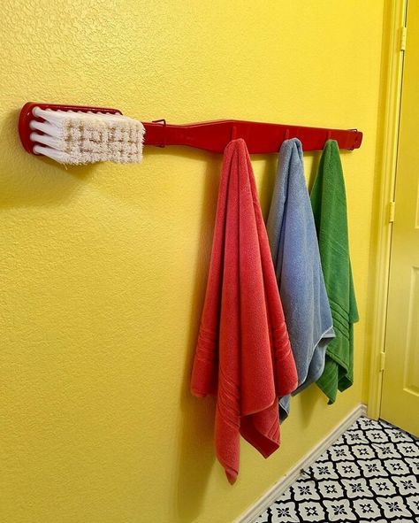 Giant Toothbrush Diy, Giant Decorations Diy, Fun Guest Room Ideas, Funky Maximalist Decor, Creative Towel Rack Ideas, Fake Cereal Bowl, Kaarin Joy, Giant Toothbrush, Colorful Small Bathroom