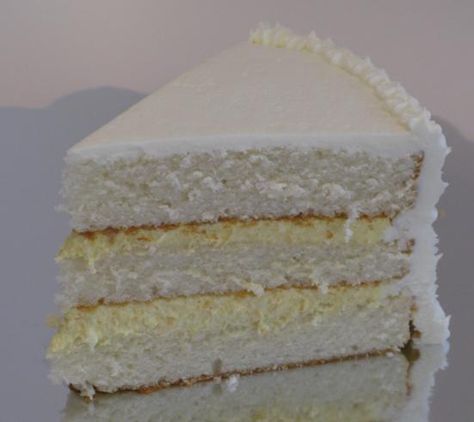 White Almond Cake with Bavarian Cream Filling and White Truffle Icing Cakes For Summer, White Almond Cake, Filled Cakes, Cake Cream Filling, Bavarian Cream Filling, White Almond Cakes, Cream Wedding Cake, White Chocolate Icing, Whipped Cream Icing