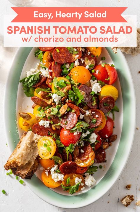 This hearty Spanish tomato salad combines juicy tomatoes, salty feta, spicy chorizo, and crunchy almonds to create an irresistibly textured, flavorful dish! Spanish Salad, Chorizo Salad, Bbq Salads, Hearty Salads, Colorful Salads, Ripe Tomatoes, Juicy Tomatoes, Tomato Salad, Fresh Herbs