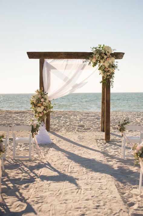 Pretty Pink Beach Wedding With An Elegant, Formal Reception | Stephanie A Smith Photography | Carolina Herrera Wedding Dress | wooden alter with blush roses, peonies, eucalyptus & draped fabric Pink Beach Wedding, Carolina Herrera Wedding Dress, Beach Wedding Pink, Beach Wedding Decorations Reception, Dream Beach Wedding, Beach Wedding Inspiration, Wedding Beach Ceremony, Beach Ceremony, Beach Wedding Decorations