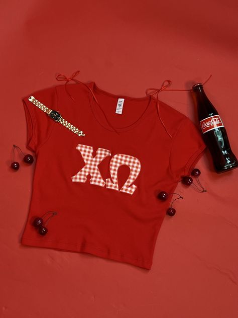 Sweet like cherries, classic like Coca Cola, and cute like this baby tee! 🍒❤️🥤 #sorority #outfitinspo #recruitment #bidday #chiomega #xo sorority designs, college, bid day inspo, chi omega Diy Sorority Merch, Diy Sorority Shirts, Diy Tee Shirt Ideas, Cool Sorority Merch, Fall Sorority Shirts, Cute Sorority Shirts, Cherry Sorority, Cherry Sorority Shirt, Cute Sorority Merch