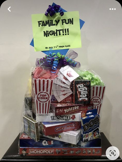 Family Fun Auction Basket Ideas, Games Gift Basket Ideas, Cornhole Raffle Basket, Board Games Basket Ideas, Movie Theme Basket Ideas Silent Auction, Family Night Raffle Basket Ideas, What To Put In A Movie Night Gift Basket, Family Game Basket Ideas, Family Game Night Raffle Basket Ideas