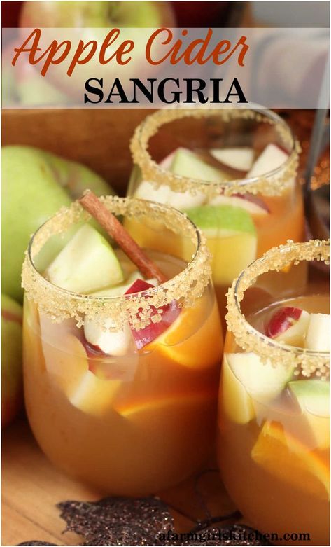 Stemless wine glasses with rims dipped in sugar, with apple cider sangria, chunks of red and green apples, oranges and cinnamon sticks. Apple Sangria Recipes, Wine Sangria Recipe, Thanksgiving Sangria, Apple Cider Sangria Recipe, Fall Sangria Recipes, Moscato Sangria, Caramel Apple Sangria, White Wine Sangria Recipe, Sangria Pitcher