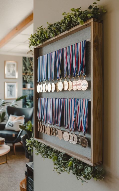 A stylish medal rack displaying a collection of race medals in a neat and organized fashion. Diy Medal Display, Medal Display Ideas, Diy Medal, Race Medal Displays, Sports Medal Display, Running Medal Display, Surf Room Decor, Medal Displays, Race Medals