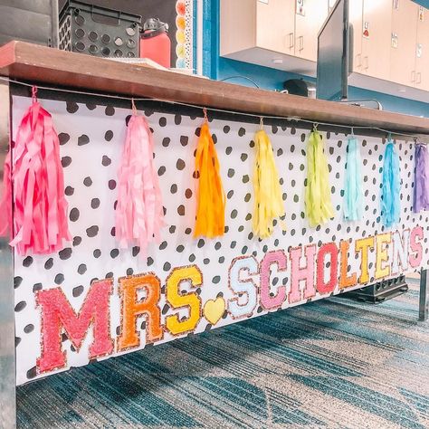 We Are Going To Have A Colorful Year, Kindergarten Classroom Teacher Desk, Colorful Classroom Theme High School, Teacher Desk Name Banner, Cricket Classroom Ideas, Teacher Desk Garland, Teacher Kindergarten Classroom, How To Decorate A Preschool Classroom, Stony Clover Classroom