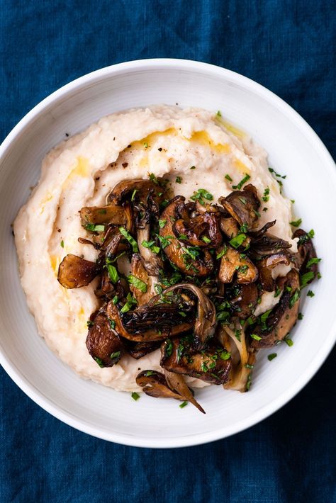 This combo of creamy white beans and garlic sautéed mushrooms is a fancy - albeit ridiculously easy-to-make - vegan main course. Perfect for Thanksgiving, Christmas, and other festive gatherings! thenewbaguette.com #whitebeanpuree #sauteedmushrooms #garlicmushrooms #mushroomrecipe Protein Entrees, Creamy White Beans, White Bean Puree, Bean Puree, White Bean Recipes, Vegan Main Course, Sautéed Mushrooms, Cooking Dried Beans, Vegetable Puree