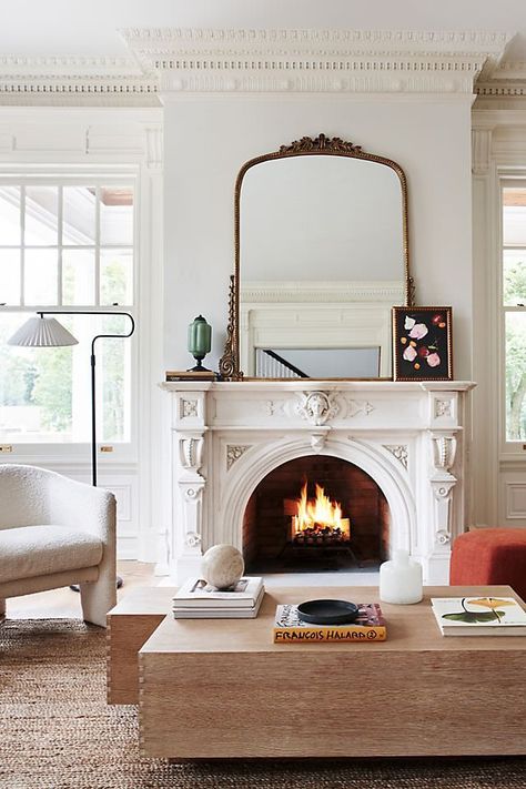 The Anthropologie mirror is basically social media famous, and I found the best Anthropologie mirror dupes online with the same antique look. Styling Anthropologie Mirror, Vintage Mirror Above Fireplace, Brass Mirror Above Fireplace, Mirrors Over Couch Living Rooms, New Orleans Decor Interiors Living Room, Gold Vintage Living Room, Large Mirror Over Fireplace Living Room, Dark Academia Fireplace Mantle, Mirror In Fireplace