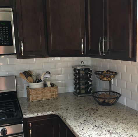 Dark cabinets, white subway tile and neutral granite Metal Kitchen Cabinets, Backsplash With Dark Cabinets, Backsplash Kitchen Dark Cabinets, Kitchen Ideas Dark Cabinets, Kitchen Ideas Dark, Brown Cabinets, Dark Kitchen, New Kitchen Cabinets, White Subway Tile