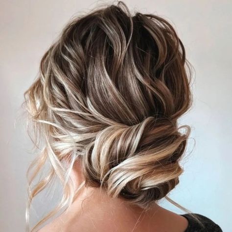 Loose Twisted Low Bun Twisted Low Bun, Loose Chignon, Twisted Bun, Messy Hair Updo, Loose Updo, Mother Of The Bride Hair, Hair Adviser, Updo Styles, Up Dos For Medium Hair