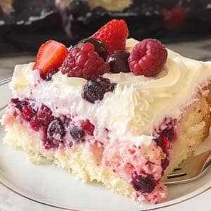 Berries and Cream Poke Cake Recipe - Masters of Kitchen - Recipes Cream Cheese Poke Cake, Raspberry Poke Cake, Raspberry Cream Cake, Slush Cake Recipe, Mix Berry Cake, Italian Cream Poke Cake, Strawberries And Cream Poke Cake, Berries And Cream Cake, Berries And Cream Poke Cake