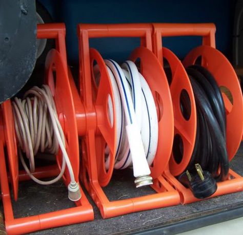 18. Organize power cords and water hoses with hose reels. Rv Organization Ideas, Vintage Trailer Decor, Rv Living Organization, Camper Kitchen, Camper Organization, Trailer Decor, Rv Organization, Rv Water, Hose Storage