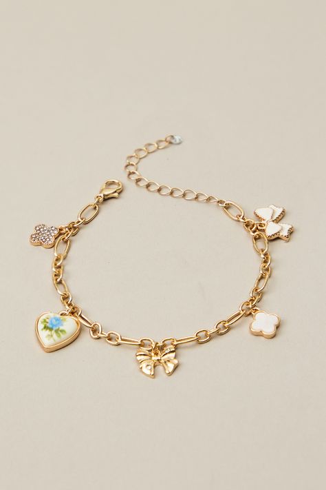 This charm bracelet features a dainty floral heart and bow pendant that will add a sweet touch of elegance to any outfit. What To Get Bestie For Christmas, Multi Charm Bracelet, Altered State Jewelry, Charm Friendship Bracelet, Dainty Charm Bracelet, Christmas Wishlist Ideas Aesthetic, Christmas Charm Bracelet, Charm Bracelet Ideas, Cute Charm Bracelets