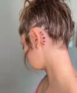 100 Amazing Behind the Ear Tattoos for 2023! - Tattoo Twist Being Ear Tattoo, Small Tattoo By Ear, Tattoos That Look Like Jewelry, Moon Phase Behind Ear Tattoo, Pretty Tattoos Behind The Ear, Boho Behind Ear Tattoo, Space Tattoo Behind Ear, Pisces Tattoo Behind The Ear, Spiritual Ear Tattoo