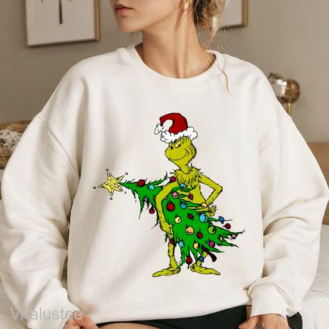 Grinchmas Christmas Tree Sweatshirt Check more at https://viralustee.com/product/grinchmas-christmas-tree-sweatshirt/ Pastel Grinch, Christmas Gifts Easy, Grinch Stuff, Christmas Wine Glasses, Quilt Size Chart, Kids Birthday Shirts, Christmas Tee Shirts, Barbie Costume, Wallet Minimalist