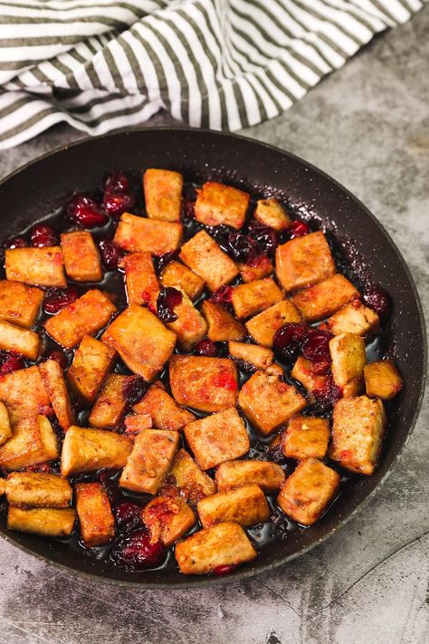 This festive Pan-Fried Tofu with Cranberry Sauce is easy to prepare and oh-so-delicious. It's a sweet and tangy flavor explosion! Vegan Thanksgiving Main Dish, What Is Tofu, Cranberry Juice Benefits, Thanksgiving Main Dish, Pan Fried Tofu, Fresh Eats, Cranberry Sauce Recipe, Cranberry Recipes, Fried Tofu