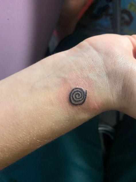 Tattooed spiral design Spiral Wrist Tattoo, Blue Spiral Tattoo, Spiral Tattoo Placement, Spiral Hand Tattoo, Organic Tattoo Design, Spiral Sun Tattoo, Spiral Tattoo Ideas, Koru Tattoo, Spiral Tattoo