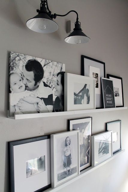 Such a cute gallery wall alternative. Like how they worked with the sconce too. | Chris Loves Julia: Photo Ledges O Fun Photo Ledge, Koti Diy, Framed Photos, Picture Ledge, Floating Shelves Diy, Picture Hanging, Wall Gallery, Banquette, Photo Displays