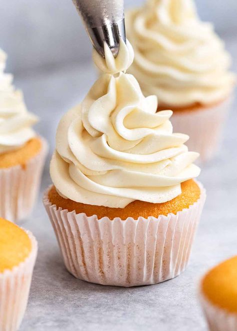 Close up piping Fluffy Vanilla Frosting onto Vanilla Cupcake Fluffy Vanilla Frosting Recipe, Fluffy Vanilla Frosting, Eggless Cupcakes, Vanilla Frosting Recipes, Ermine Frosting, Types Of Frosting, Fluffy Frosting, Easy Frosting, Cake Frosting Recipe