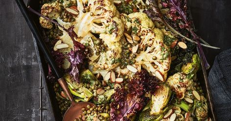 Cauliflower and brussels sprouts flourish this time of year. Put the two together in this delicious and nutritious vegetarian tray bake topped with a punchy acidic dressing. Substitute For Meat, Vegetable Lasagne, Lentil Burgers, Hearty Dinner Recipes, Tray Bake, Lentil Stew, Tasty Vegetarian Recipes, Hearty Dinner, Vegetarian Cooking