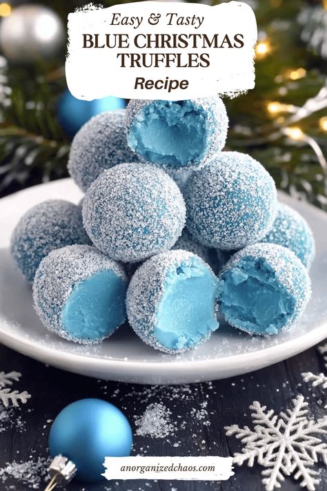 Blue Christmas Truffles start with a smooth white chocolate ganache, beautifully tinted by blue curacao, which adds a touch of warmth as they melt in your mouth. These truffles deliver a luscious blend of creamy white chocolate with a subtle citrusy note. White Chocolate Chips: 2 cupsHeavy Cream: 2 tablespoonsBlue Curacao: 2 tablespoonsSanding Sugar: 1/2 Blue Truffle Balls, Chocolate Christmas Candy Recipes, Good Christmas Dessert Recipes, Christmas Treats Chocolate, Easy Yummy Christmas Desserts, Blue And White Food Ideas, Christmas Cookie Truffles, Blue Themed Desserts, Sweet Holiday Treats