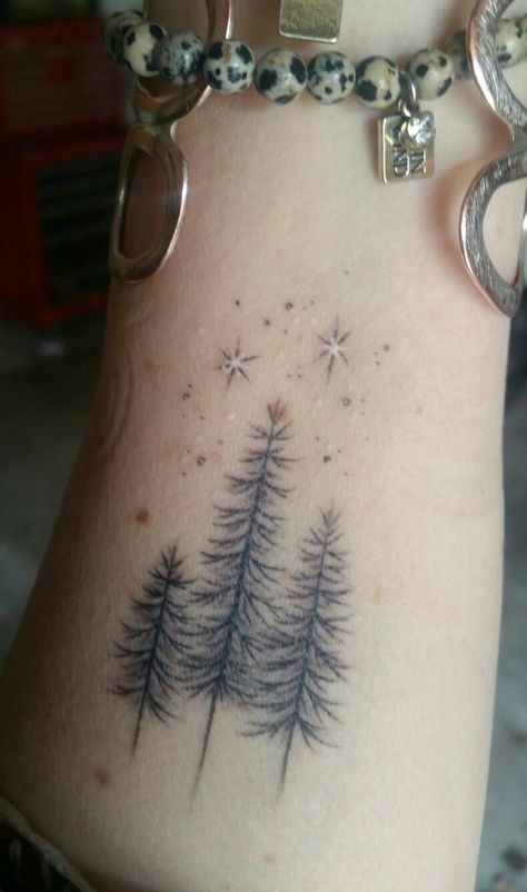 Pine Tree With Flowers Tattoo, Dainty Forest Tattoo, Outdoor Family Tattoo Ideas, Trees And Stars Tattoo, Delicate Tree Tattoos For Women, Winter Sleeve Tattoo, Tree And Stars Tattoo, Winter Tattoos For Women, Snowy Tattoos