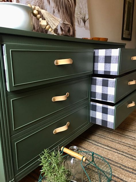 Olive green refinished dresser with buffalo check pattern on drawer sides. Reminds me of cabin with wood stoves nestled in a spruce tree forest. Dark Green Refurbished Dresser, Green Upcycled Dresser, Dark Green Dresser Diy, Green Refinished Furniture, Hunter Green Dresser Diy, Farmhouse Green Dresser, Green Dresser With Wood Top, Black And Green Dresser, Olive Green Nightstand