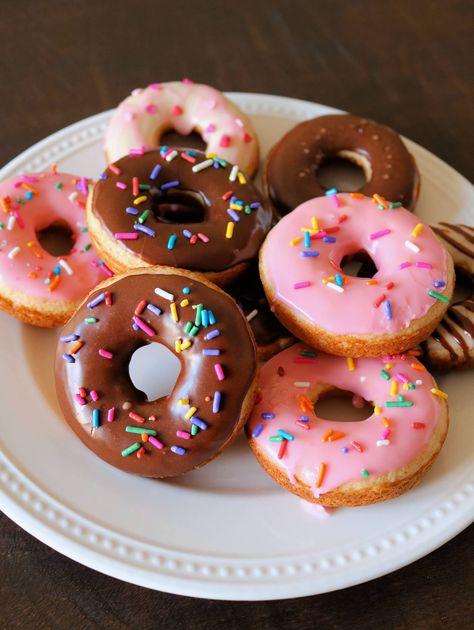 These Easy Cake Mix Donuts are delicious and so simple to make! These yellow cake mix donuts are made with a boxed cake mix and baked instead of fried. Top them off with one of my delicious glazes including vanilla, chocolate, or maple, and decorate with fun sprinkles. Kids and adults will love them for breakfast or dessert! #donuts #cakemixdonuts #cakemix #dessert #breakfast Cake Mix Donuts Recipe, Cake Mix Donuts, Donut Baking Pan, Doughnut Recipe Easy, Homemade Donuts Recipe, Baked Donut Recipes, Chocolate Glazed Donuts, Vegetarian Cake, Homemade Donuts