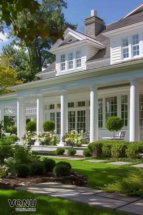 Elegant White Colonial Home with Grand Porch Colonial Hamptons Style, Colonial House With Wrap Around Porch, House With Columns And Porch, Grand Millennial House Exterior, White House Blue Shutters French Country, Traditional Southern Home Exterior, Hamptons Exterior House, Colonial Ranch House Exterior, Cottage Style Home Exterior