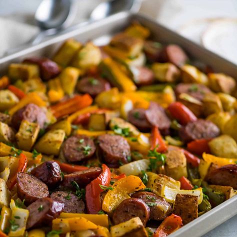 Sausage and Potatoes (Bake in Oven) Dutch Oven Sausage And Potatoes, Baked Sausages In Oven, Kielbasa And Potatoes Bake, Sausage And Potatoes In Oven, Oven Baked Sausage, Sausage Sheet Pan Meal, Sausage Potatoes And Peppers, Bake Sausage In Oven, Polish Sausage Recipes