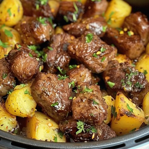 Transform your mealtime into a quick and savory delight with "Quick Feast: Air Fryer Garlic Butter Steak Bites and Potatoes." This recipe leverages the convenience and speed of an air fryer to create a succulent, Air Fryer Garlic Steak Bites And Potatoes, Steak Bites And Potatoes With Garlic Butter Air Fryer, Air Fryer Steak And Potato Bites, Air Fryer Garlic Butter Steak Bites And Potatoes, Steak And Potato Air Fryer, Meat Bites Recipes, Airfryer Steak And Potatoes, Steak And Potatoes In Air Fryer, Air Fryer Garlic Butter Steak Bites