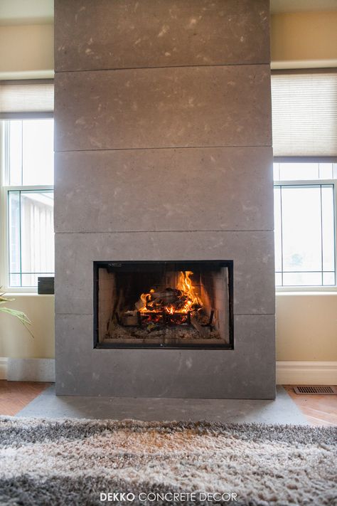 Engineered concrete panels around wood fireplace feature wall Concrete Panel Fireplace, Cement Board Fireplace, Concrete Tile Fireplace, Faux Concrete Fireplace, Interior Fireplace, Fireplace Feature, Fireplace Feature Wall, Textured Wall Panels, Cement Board