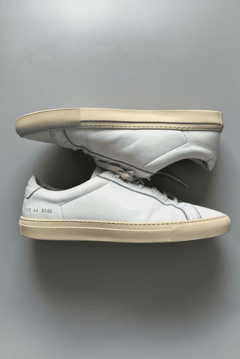 The Common Projects Achilles Low is the OG minimalist white leather sneaker that started it all. Its clean, slim silhouette pairs perfectly with tailored trousers or casual denim. Premium Italian leather upper with gold foil stamping Margom rubber cupsole provides a subtle bounce Padded leather lining for comfort Hand-lasted construction for durability Many colorways beyond white available Best Sneakers For Men, Common Projects Achilles Low, Common Projects Achilles, Italian Sneakers, Minimalist White, White Leather Sneakers, Common Projects, Sneakers For Men, Hot Sneakers