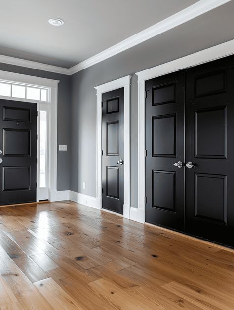 What Color To Paint Interior Doors (6 Suggestions With Pictures) Interior Paint Colors Grey, Living Room With Black Doors, Farmhouse With Black Interior Doors, Black Doors And White Trim, Charcoal Doors With White Trim, Gray Walls With Black Doors, Gray Walls White Trim Black Doors, Dark Gray Interior Doors With White Trim, Dark Brown Doors With White Trim