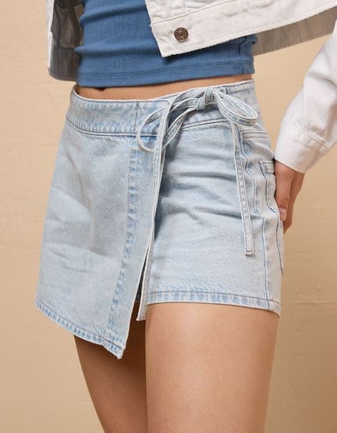 Denim Skort With Built-in Shorts For Spring, Spring Denim Skort With Built-in Shorts, Asymmetrical Medium Wash Denim Skirt, Light Wash Denim Skort Short Length, Asymmetrical Medium Wash Bottoms For Summer, Light Wash Denim Short Skort, Light Wash Denim Skort, Trendy Asymmetrical Denim Skirt, Casual Asymmetrical Cotton Denim Skirt