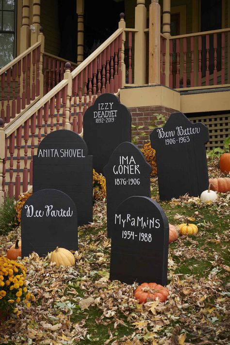 These simple DIY Halloween tombstones require a white paint pen, black paint, and a little inspiration.  #halloween #halloweenideas #diyideas #halloweendiy #bhg Tombstone Decorations Halloween, Fake Tombstones Diy, Headstone Ideas Halloween, Diy Tombstones Halloween Foam, Diy Wooden Tombstones Halloween, Easy Diy Tombstones Halloween, Foam Board Halloween Projects, Tombstone Ideas Halloween, Plywood Tombstone