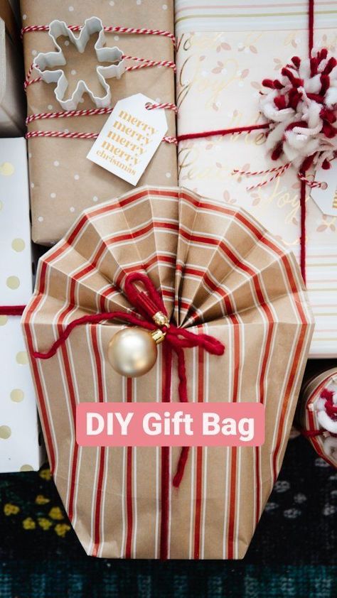 Have you ever tried making a gift bag from wrapping paper? I've done this when I need to wrap something like a stuffed animal, oddly shaped toy, or round item. This accordion fold method for the top is inspired by @beeandblooms! #thediymommy #giftwrappingideas #giftwrap #giftwrapping #christmashack | The DIY Mommy | The DIY Mommy · Original audio Gift Bags Out Of Wrapping Paper Diy, Make Bag From Wrapping Paper, How To Wrap A Basket With Wrapping Paper, Fold Gift Bag, Wrapping Paper Into Gift Bag, How To Make Gift Bag From Wrapping Paper, Make A Gift Bag Out Of Wrapping Paper, Wrapping Paper Bags Diy Video, How To Wrap A Large Stuffed Animal