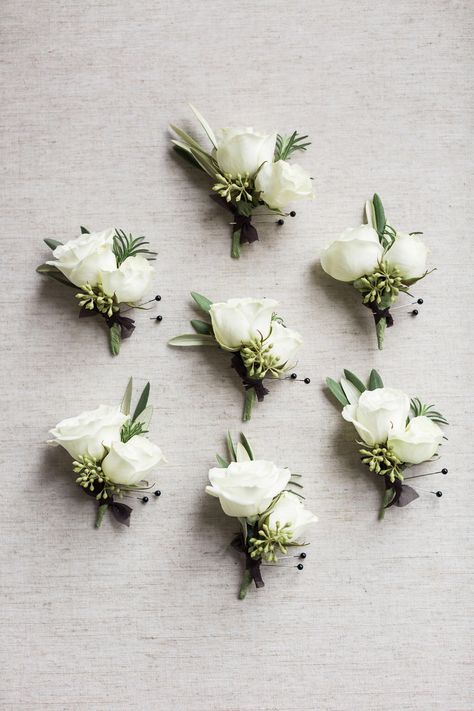 White And Green Buttonholes Grooms, White Green Buttonhole, Classic White Boutonniere, Sage Green And White Boutonniere, White And Green Buttonholes, White Boutineer Wedding, Neutral Boutonniere, Green And White Boutonniere, White Spray Rose Boutonniere