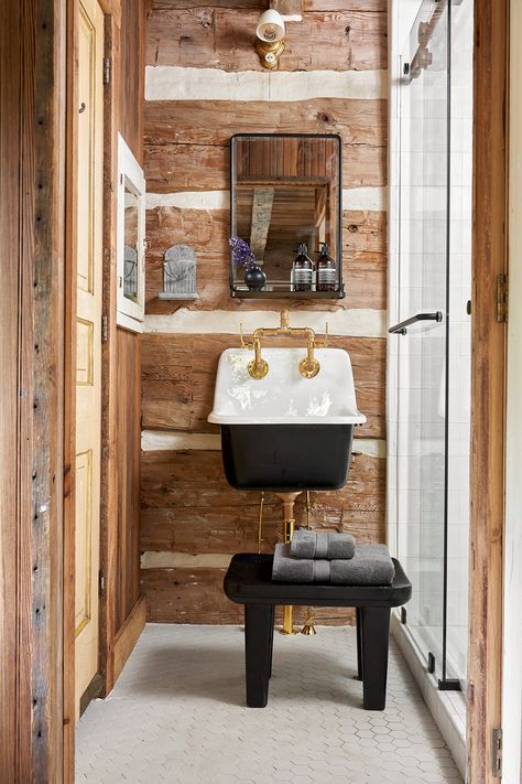 Tour a Transformed Log Cabin in Central Texas - D Magazine Cabin Remodel On A Budget, Cowboy Cabin Interior Design, Vertical Log Cabin, Updated Cabin Interior, Cabin Powder Room, Mountain Cabin Bathroom, Remodeled Cabin, Tiny Cabin Bathroom, Modern Log Cabin Interior