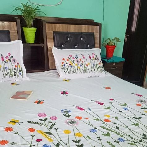 Dcushioncover Cushion on Instagram: "Beautiful hand embroidered customized bed cover 1+2 😍😍  Give ur house a traditional touch with this beautiful hand embroidered bedcover or can be gifted to  who loves the handmade or hand embroidered products  Material -cotton fabric  Size - king size 108*108"  16*27" size pillow cover    White base color  Product care instructions  ❤ wash with mild detergent ❤wash it with hands  ❤dry in shade   ❌machine wash  All our handlooms  needs our care😀😀  Customisation of color and size available  Dm us for order 😀😀  #dcushioncover #embroiderydesign  #embroideryhoop  #embroidery  #embroideryart #smallbusiness #handembroidered  #handmade  #instagram  #reels" Handmade Bed Sheets, Embroidered Sheets, Embroidered Products, Bed Cover Design, Cushion Embroidery, Easy Dress Sewing Patterns, Hand Embroidered Pillows, Embroidered Bedding, Pillow Embroidery