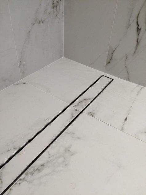 Amazing  Shower Drain Design Ideas - Engineering Discoveries Tile Inserts In Showers, Horizontal Shower Drain, Drain In Bathroom Floor, Linear Shower Drain Ideas, Bathroom Drain Ideas, Shower Drain Ideas, Tile Shower Drain, Shower Base Installation, Floor Drain Bathroom