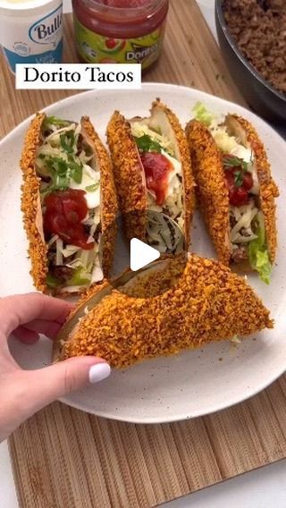 Tasty_Mania on Instagram: "Dorito Tacos

With only 10 minutes prep and 10 minutes cooking time this sensational 20 minute is totally worth it. Hit save or regret it.

INGREDIENTS
4 small soft taco shells
¾ bag doritos of your choice
6 tablespoons of BBQ sauce or hot buffalo sauce
½ brown onion
500g mince (there will be leftover)
2 tbsp taco seasoning
1 cup shredded lettuce
¾ cup shredded cheddar cheese
4 tsp sour cream
4 tsp salsa
Coriander (optional)

METHOD
- Preheat oven to 180 degrees celsius
- Crush/blend doritoes into a crumb like consistency and spread out on a plate, drizzle bbq sauce on a separate plate
- Dip one side of the tortilla into the bbq and the same side into the dorito crumb
- Hang the dorito tacos on a wire rack creating a 2cm bottom base. Place in the oven and cook fo Soft Taco Shells, Angels Singing, Crockpot Recipes Beef Stew, Chocolate Homemade, Taco Shells, Drumstick Recipes, Shredded Cheddar Cheese, Honey Soy, Soft Tacos